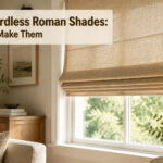 A well-lit room with cordless Roman shades installed at a window.